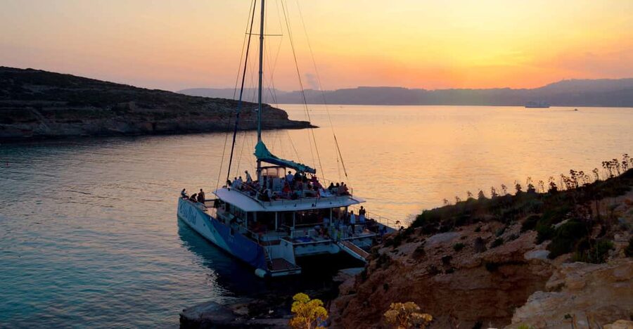 Malta: Blue Lagoon Evening Catamaran Cruise - Malta’s coast from a low, open viewpoint