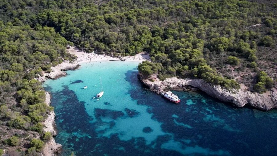 Menorca: Full-Day Boat Tour with Paella Lunch - Swimming and boat time at Son Saura