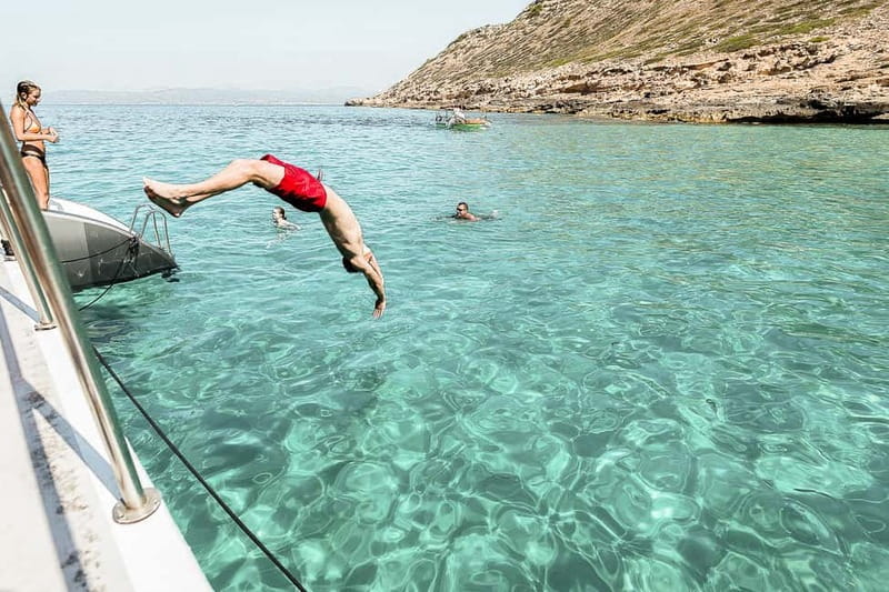 Palma de Mallorca: Half-Day Catamaran Tour with Buffet Meal - The onboard buffet and bar