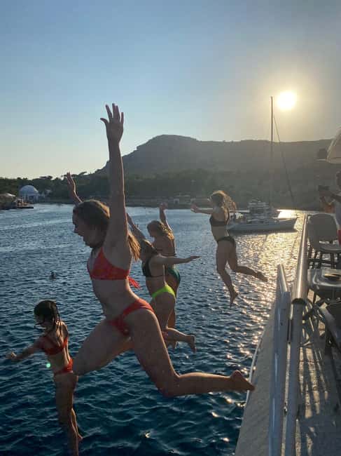 Rhodes: Sunset Cruise with Open Bar, Dinner, & Live Music - The open bar gets the evening moving