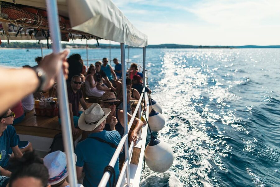 Rovinj: Sunset Cruise with Swim Stop, Drinks, and Fruits - Sunset views and the return to Rovinj