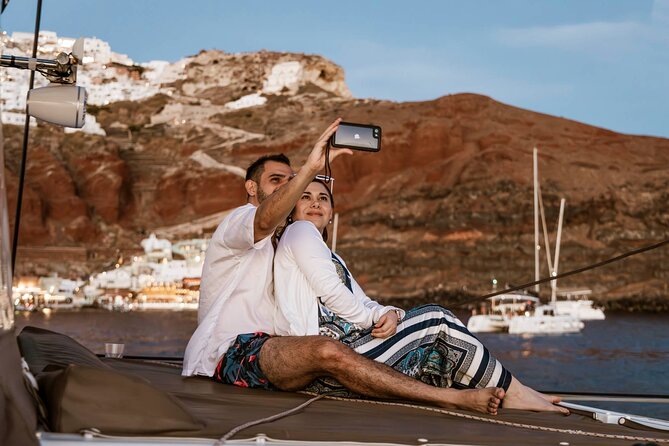 Santorini Catamaran Cruise with Greek Meal, Open-Bar and Sunset - The luxury route under Oia and past Ammoudi