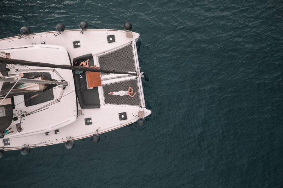 Santorini Catamaran Cruise with Swimming, Meal and Open Bar - Red Beach and White Beach from offshore