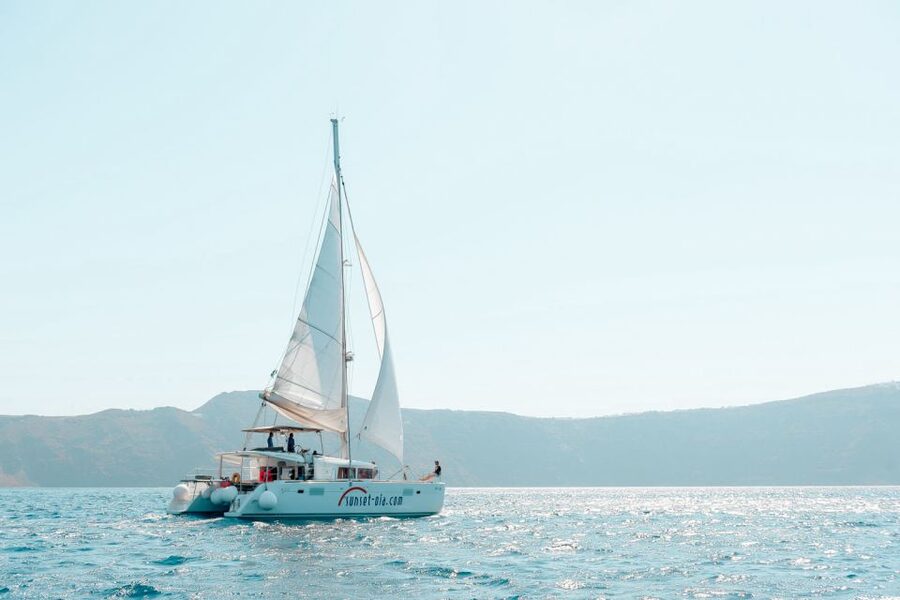 Santorini: Catamaran Tour with BBQ Meal and Unlimited Drinks - Weather, timing, and comfort advice