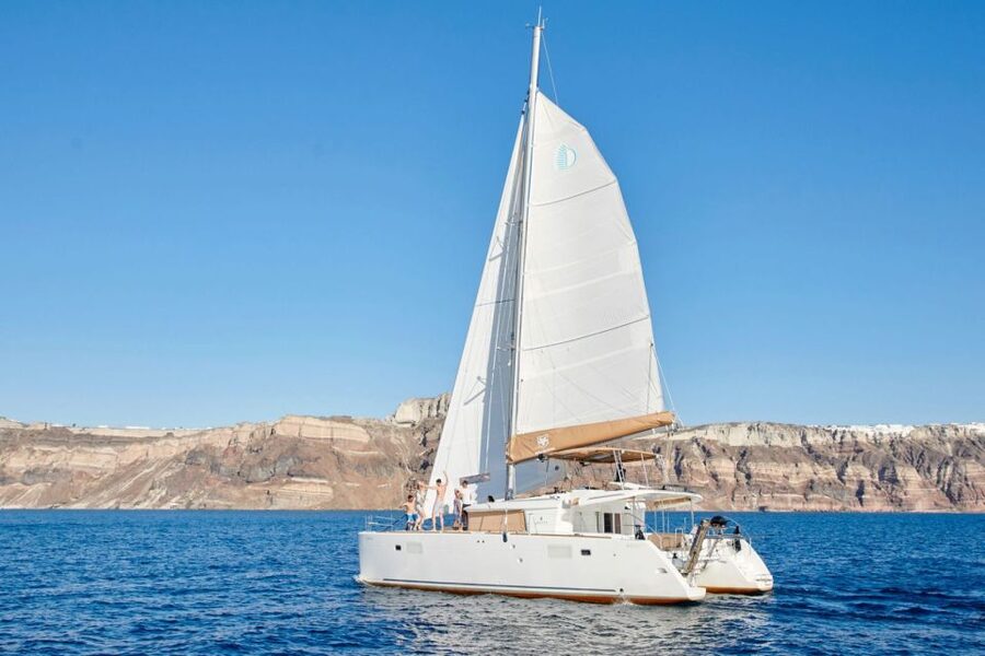 Santorini Gold Catamaran Cruise with Snorkel, BBQ & Open Bar - Mesa Pigadia and the onboard BBQ