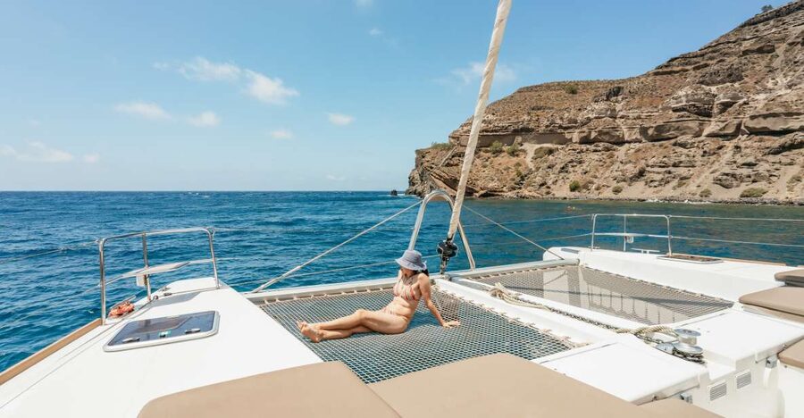 Santorini: Luxury Catamaran Day Trip with Meal and Open Bar - Red Beach and the first swim