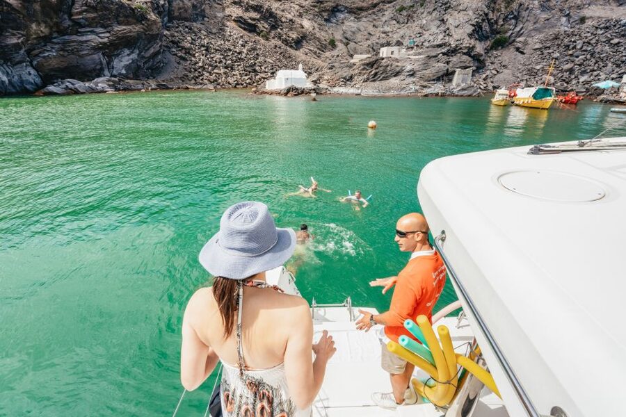 Santorini: Luxury Catamaran Day Trip with Meal and Open Bar - Sailing past Santorini’s volcanic caldera