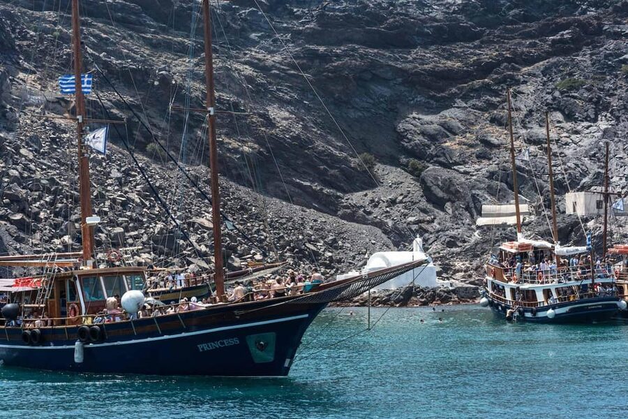 Santorini Port: Cruise to Volcano, Hot Springs & Thirassia - The slow sail past Oia, Imerovigli, and Fira