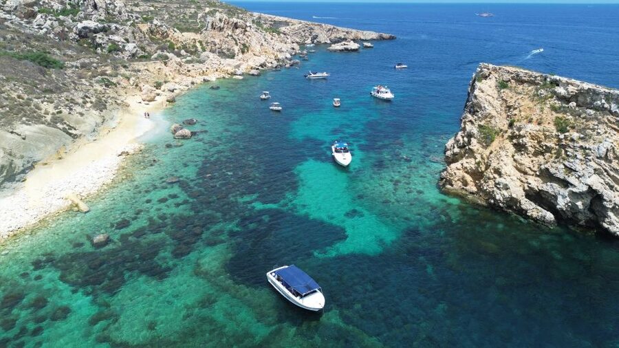 Sliema: Boat Trip to Comino Blue Lagoon, Gozo, and Caves - Caves along Comino’s limestone coast