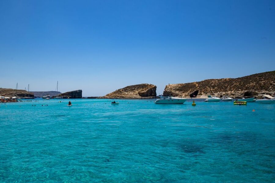 St Paul's Bay: Comino, Blue Lagoon, Gozo, & Caves Boat Tour - Blue Lagoon: beautiful water, crowded shore