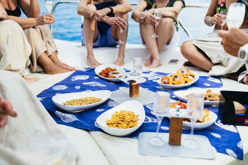 Taormina: Sunset Boat Tour with Dolphin Watching & Aperitif - Isola Bella, Mazzaro Bay, and the swim stop