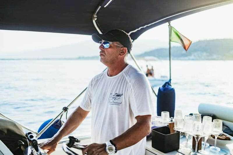 Taormina: Sunset Boat Tour with Dolphin Watching & Aperitif - Sunset, snacks, and a glass of bubbles