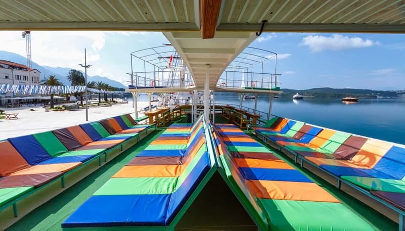 Tivat/Kotor: Boka Bay Full-Day Guided Cruise with Swim Stop - Our Lady of the Rocks and the view toward Perast