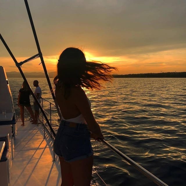 Valencia: Sunset or Daytime Catamaran Cruise with Drink - Leaving the marina: yachts, cruise ships, and the city edge