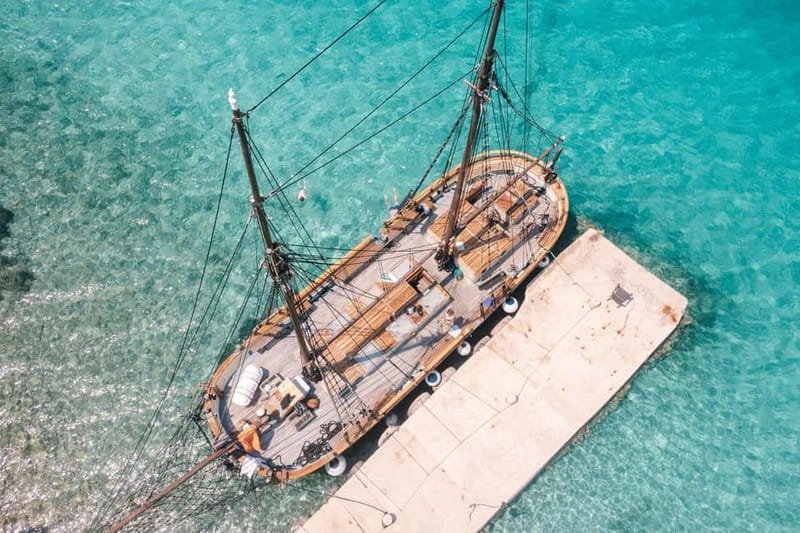 Zadar: Boat Tour with Unlimited Wine & 3 Stops - Boarding the old wooden boat in Zadar