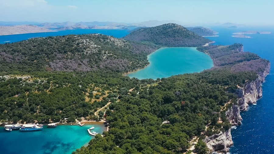 Zadar: Kornati Boat Trip with Lunch and Swim Stops - Swimming, walking, and the return to Zadar